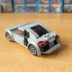 Image for article titled This Cool Fan-Made LEGO Iron Man Garage Has Some Great Models Of The Audi R8 And AC Cobra, Too